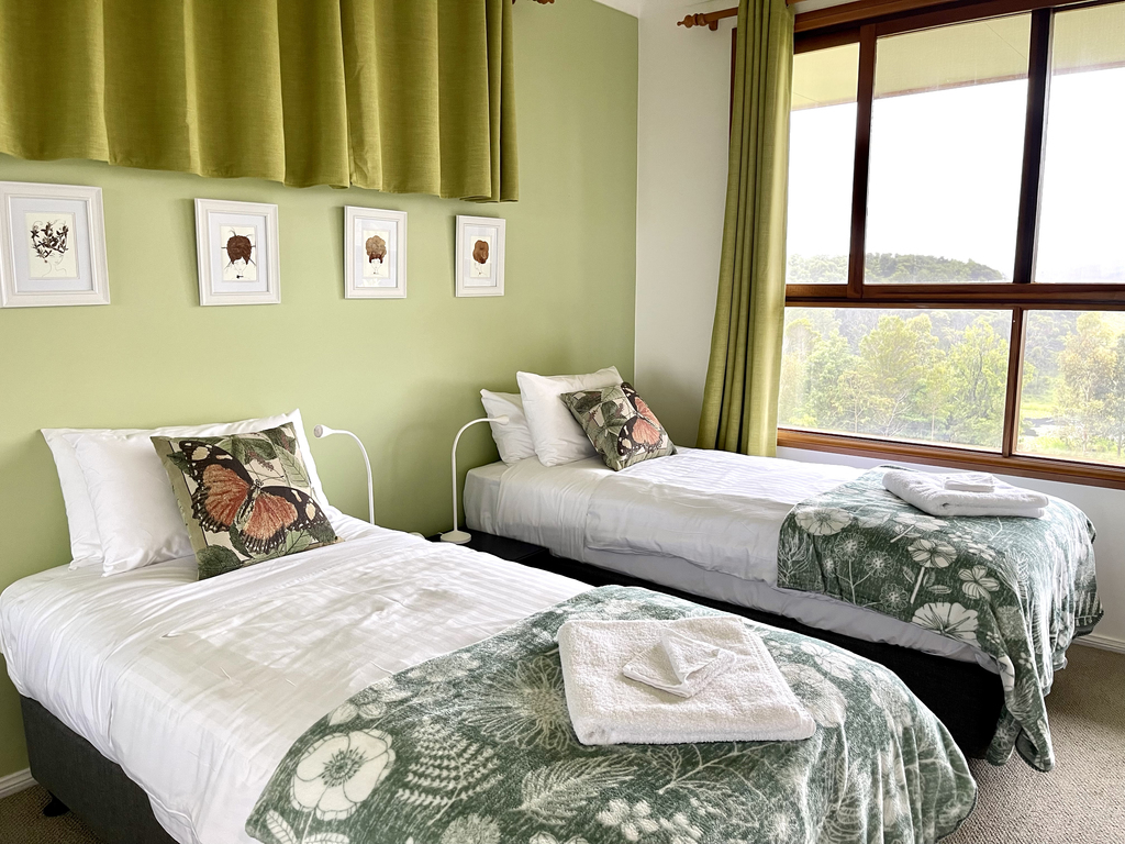 A photograph of the Green Room with twin King Single beds