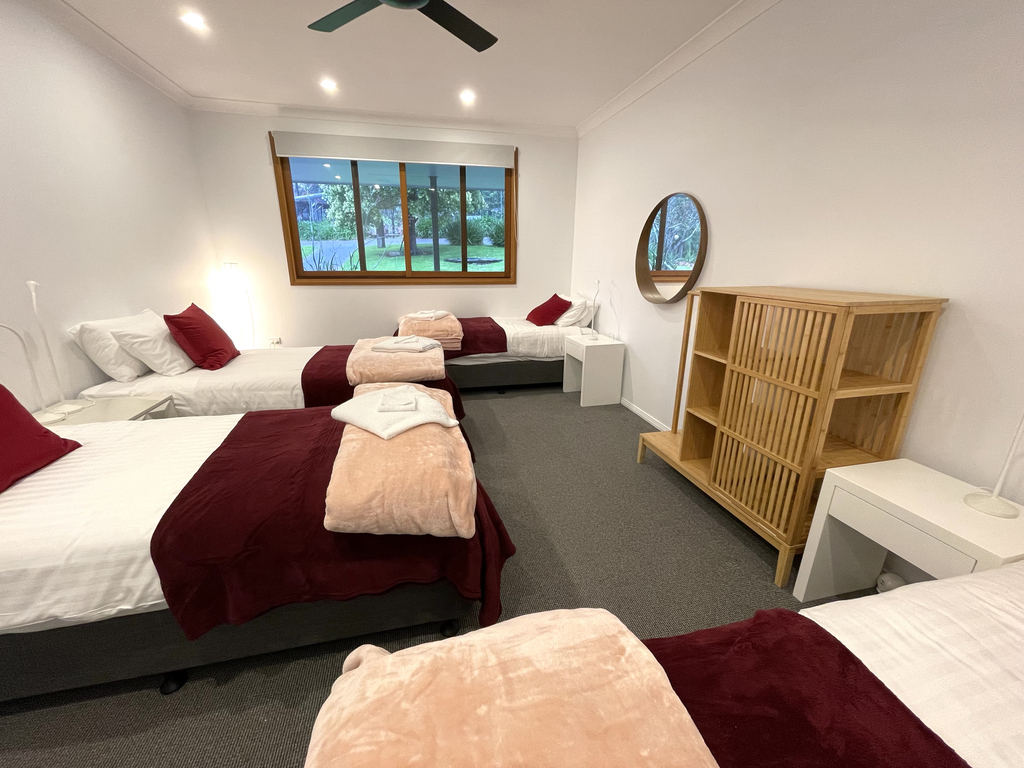 A photograph of the Quad Share Room with twin King Single beds