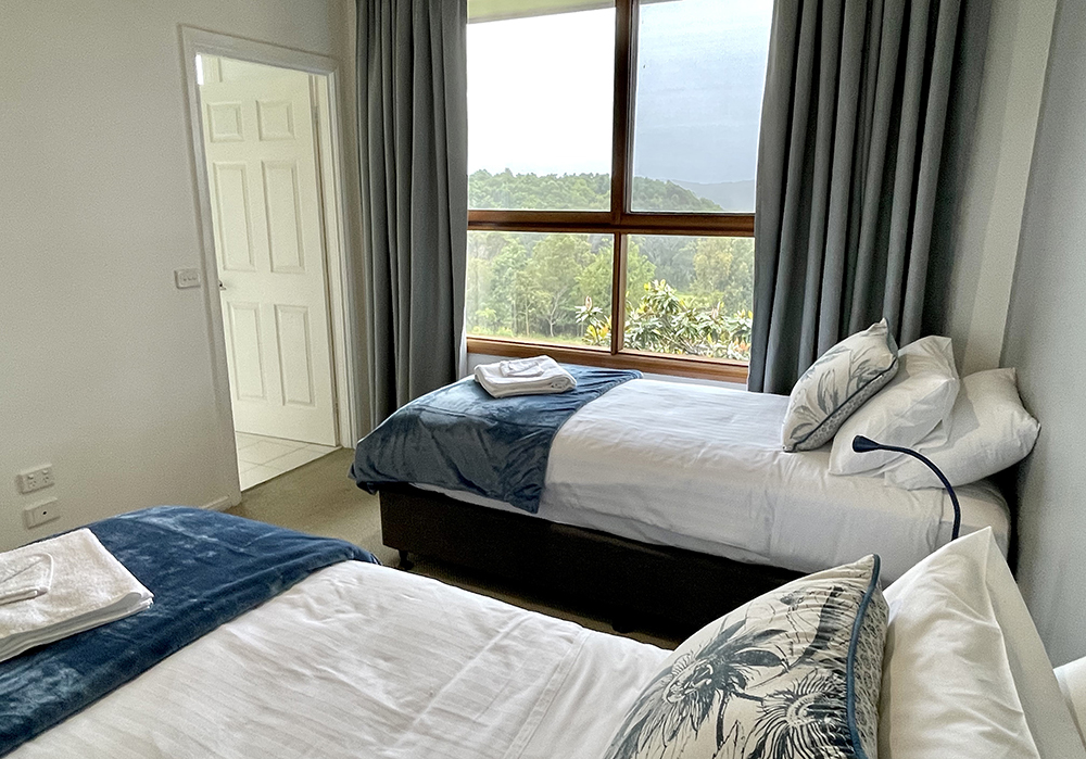 A photograph of the Blue Room with twin King Single beds