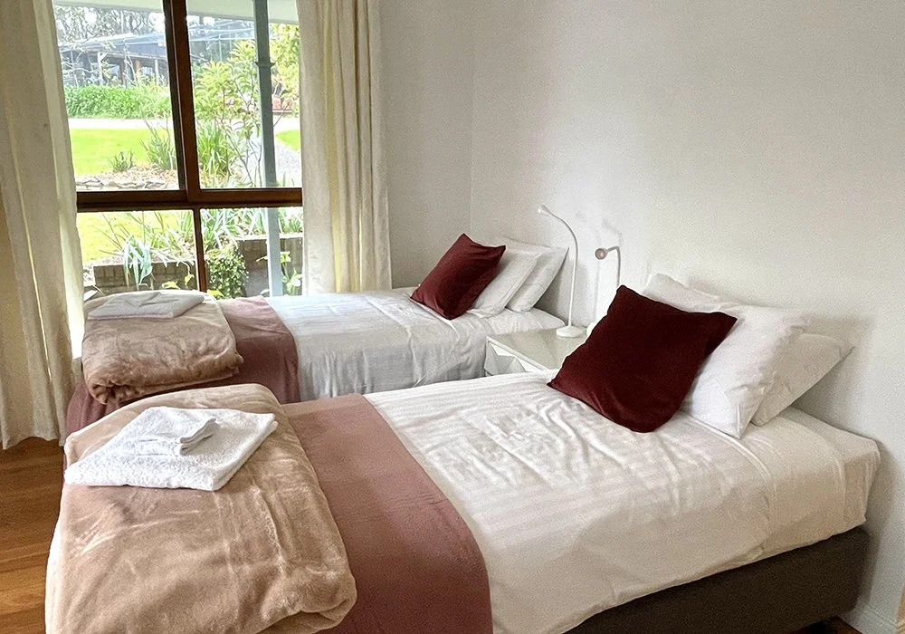 A photograph of the Ensuite Room with twin King Single beds